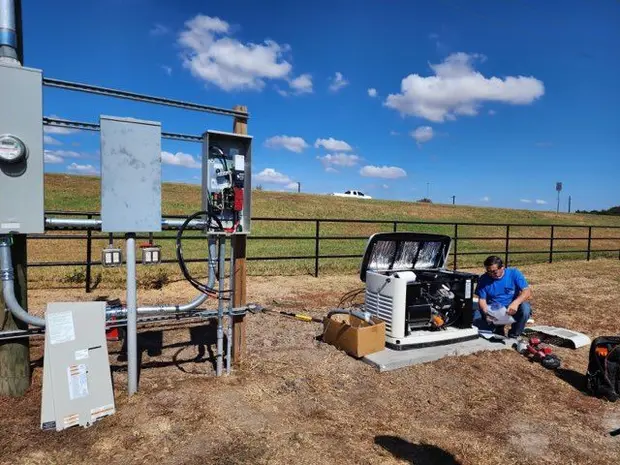 CC Electric technician installing a standby generator in the Brazos Valley
